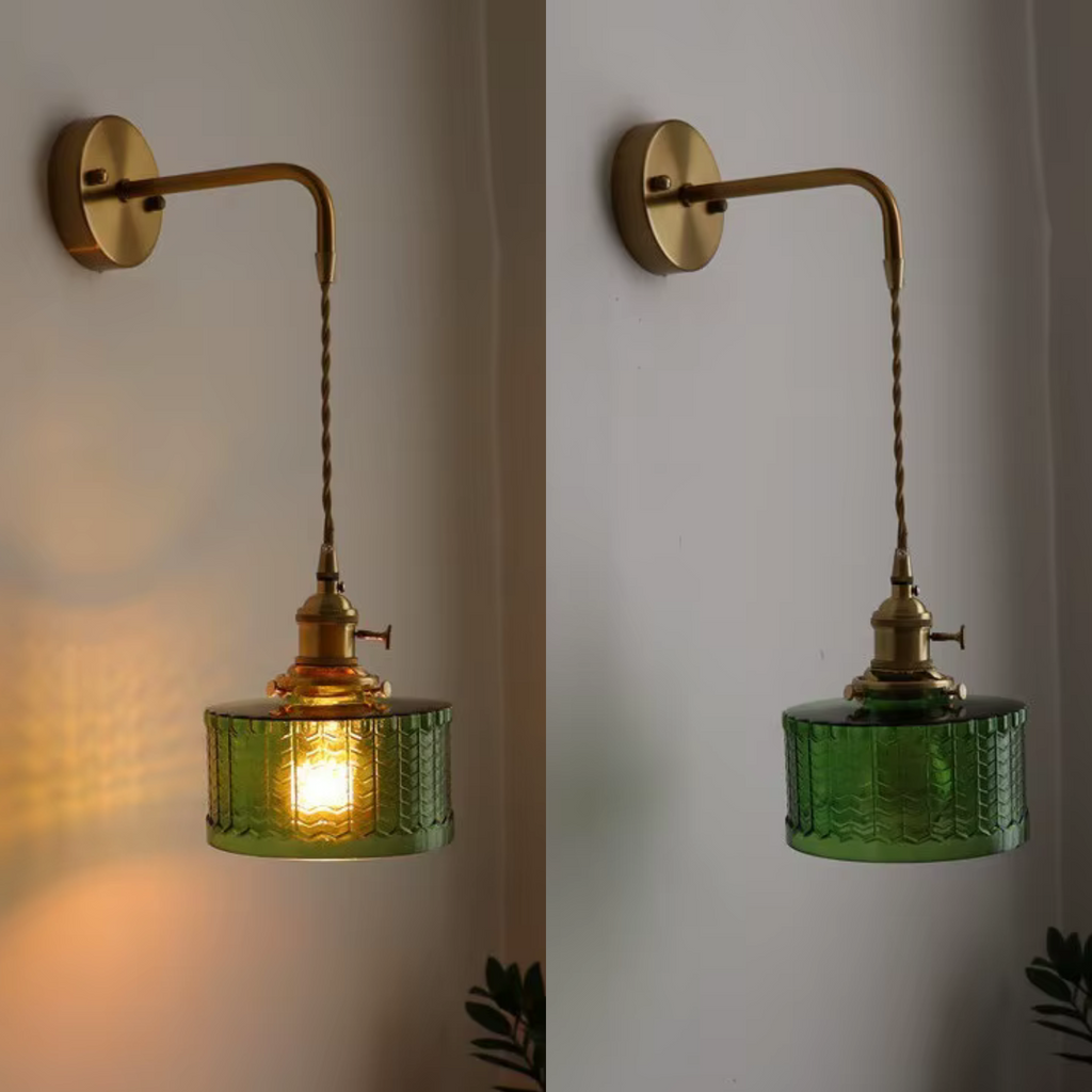 Glass Wall Sconce with Textured Ribbed Shade and Aged Brass Arm - Image 1