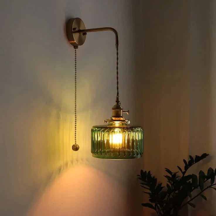 Plug in Wall Sconce with Vintage Brass Arm and Green Glass Shade - Image 1